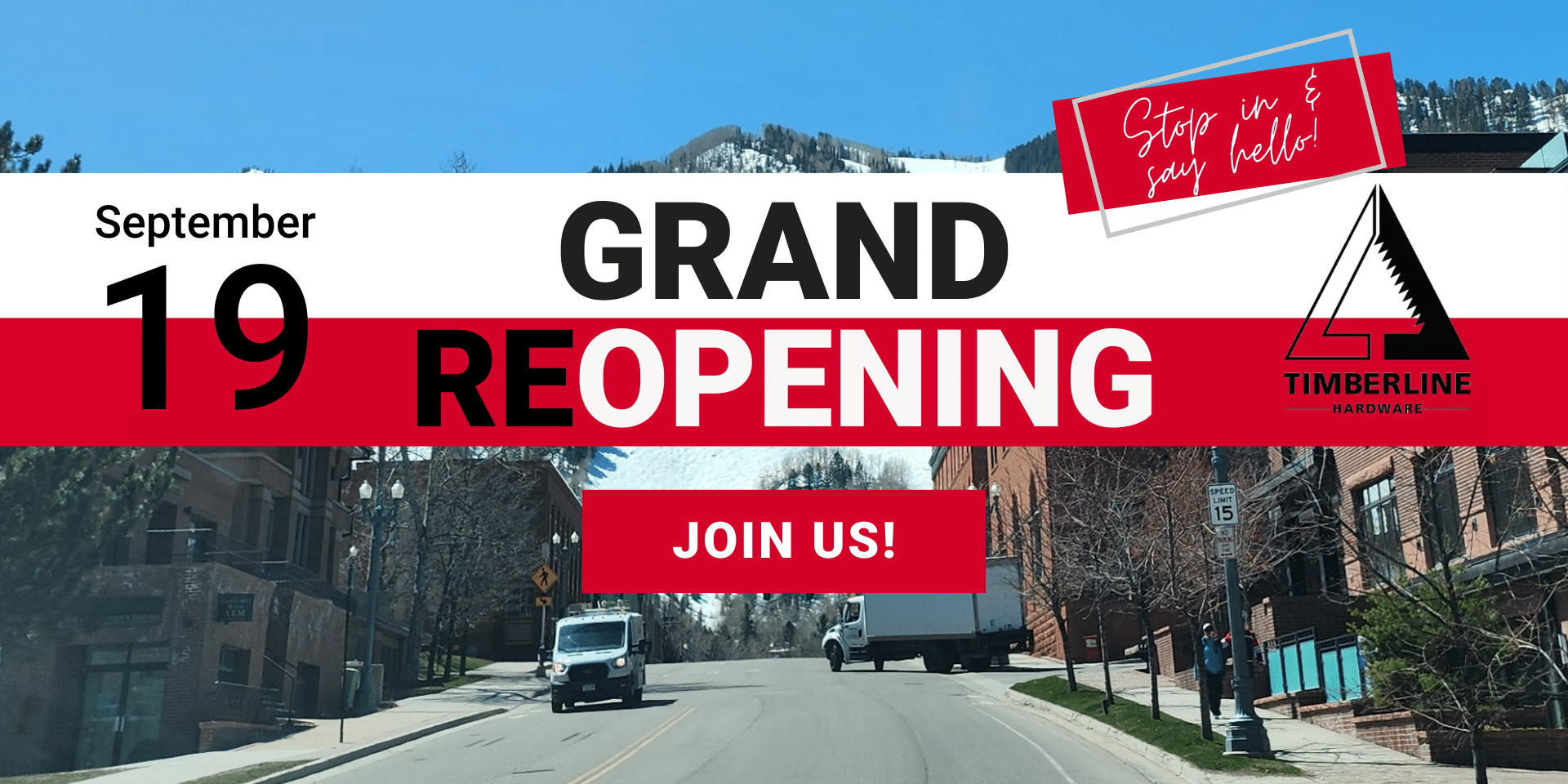 grand reopening banner with photo of downtown Aspen and mountains