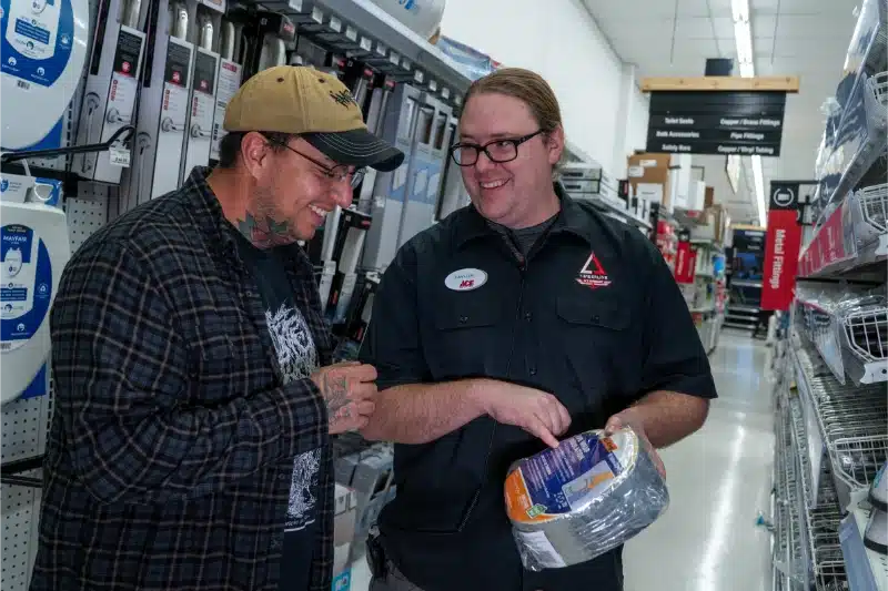 employee helping customer at clifton ace