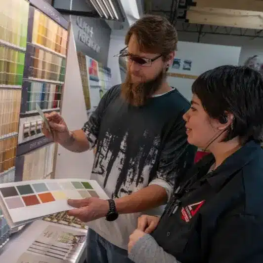 helping customer with paint choices