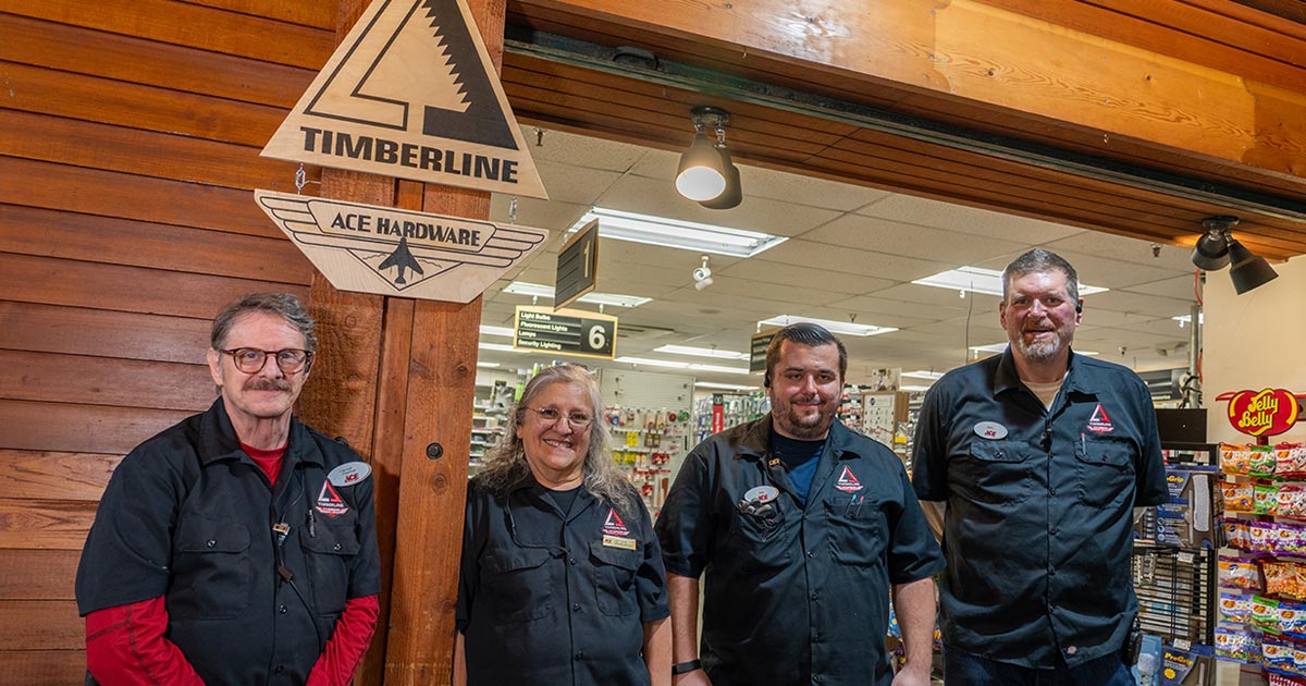 Timberline Ace Hardware team members posing for photo inside their store