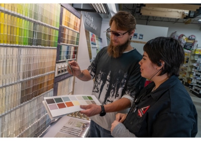 Timberline Ace of Battlement Mesa team member helping customer in the paint department with paint matching services