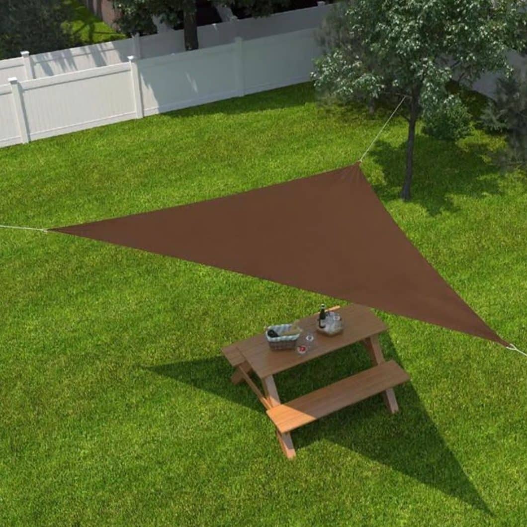 Triangle shade sail canopy installed over backyard picnic table