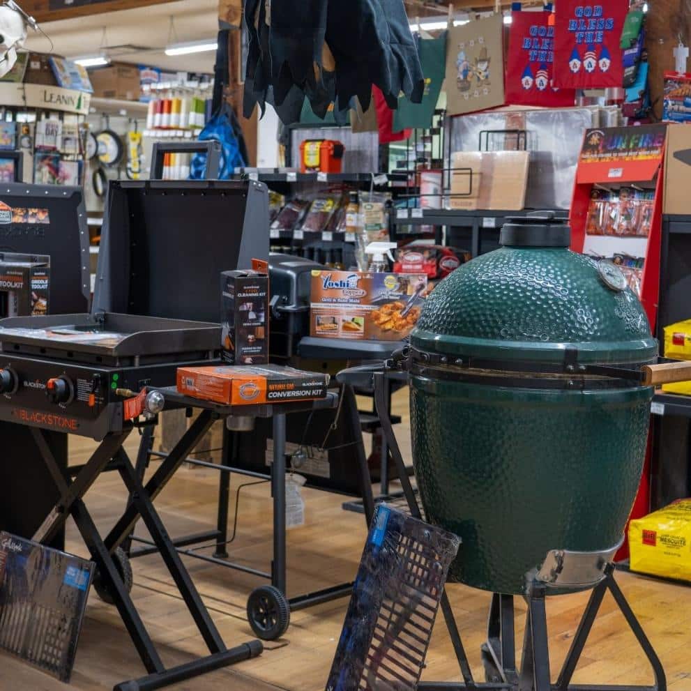 Big Green Egg and Blackstone grill display at Timberline Ace Hardware of Norwood