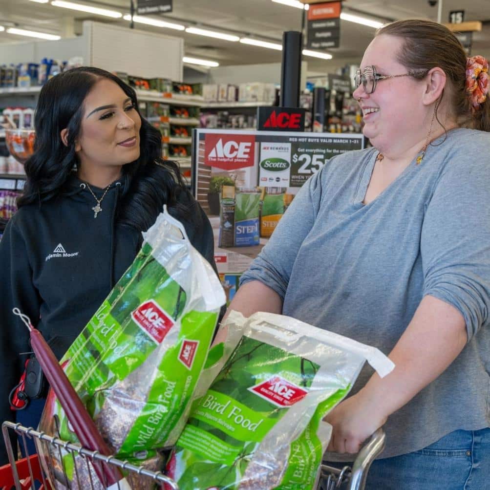 Team member helping customer select bird seed at Timberline Ace Hardware of Carbondale
