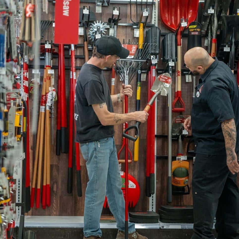 Customer and team member selecting yard tools at Timberline Ace Hardware of Clifton